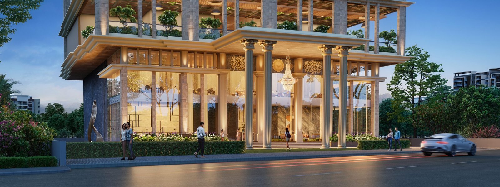 The Arkaa's illuminated entrance and porte-cochère in the evening